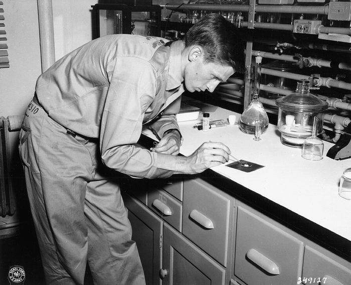 Historic photograph of a man working at a laboratory bench